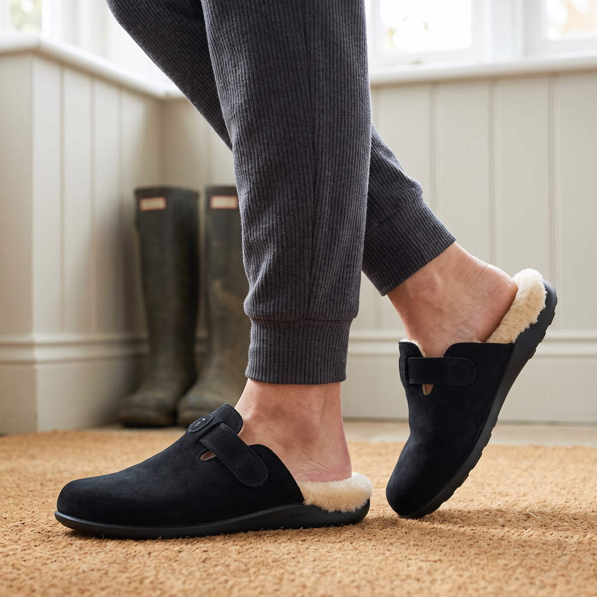 Black Strive slippers in bathroom