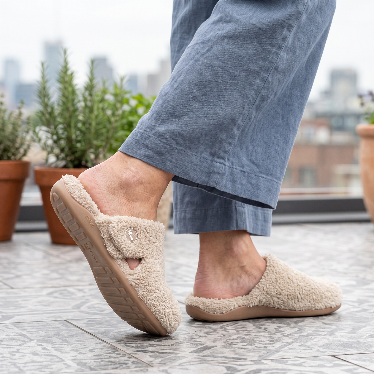 Grey Strive Slippers in the green house